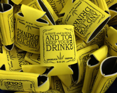 Custom Wedding Koozies for table decoration. These are single color screen printed on both sides. Yellow koozie with black ink. Custom Wedding Koozies