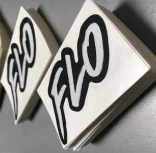 Stacks of Flow stickers. Flo black and white stickers