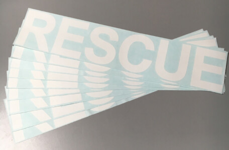 Di-cut peel and stick style of sticker. White Rescue stickers